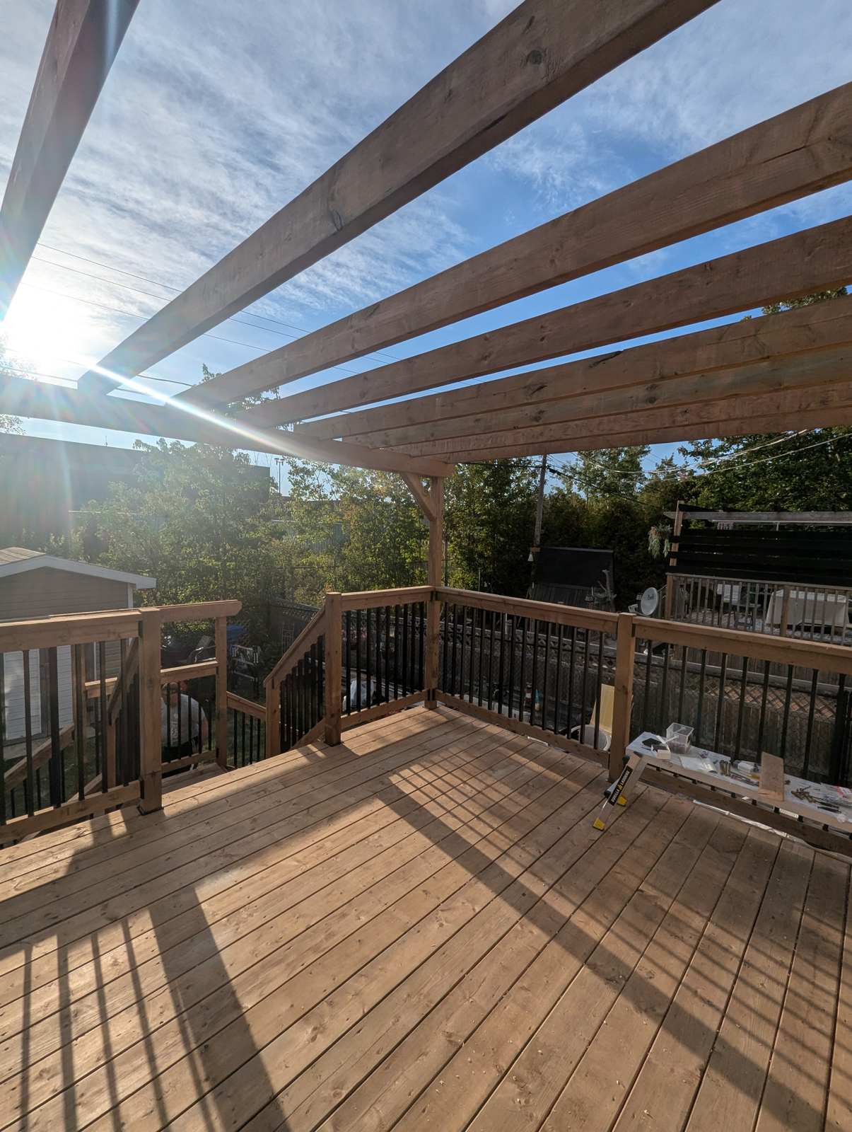 Finished pressure-treated deck surface under pergola, Ayers Avenue