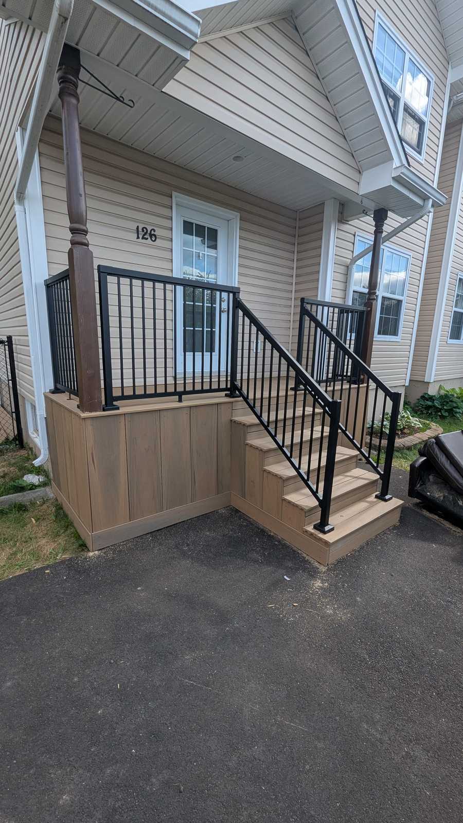 Finished front composite entry deck with matching black aluminum railing, Chianti Street, Dieppe NB