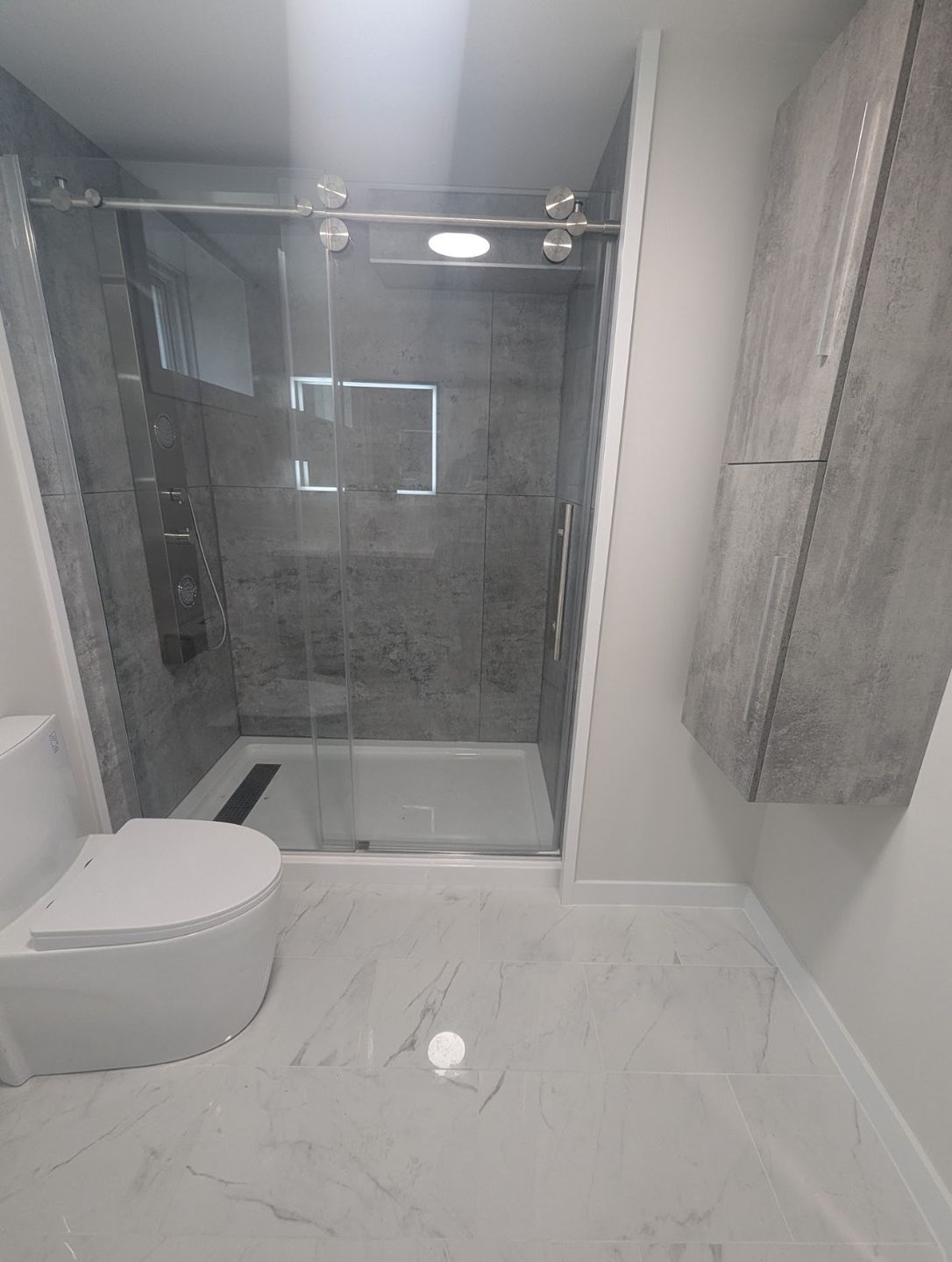 Bathroom after renovation by Valhalla Construction, Chianti Dieppe NB
