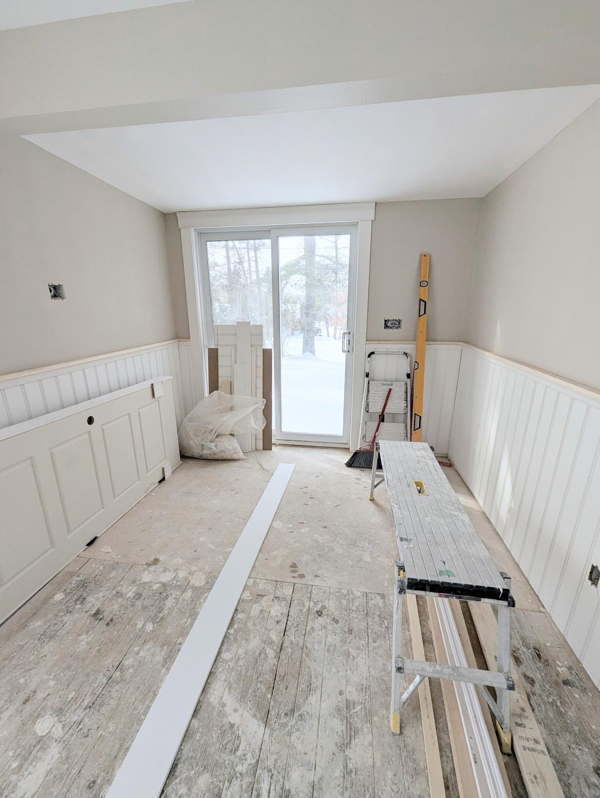Wainscoting materials staged for installation in a living room renovation