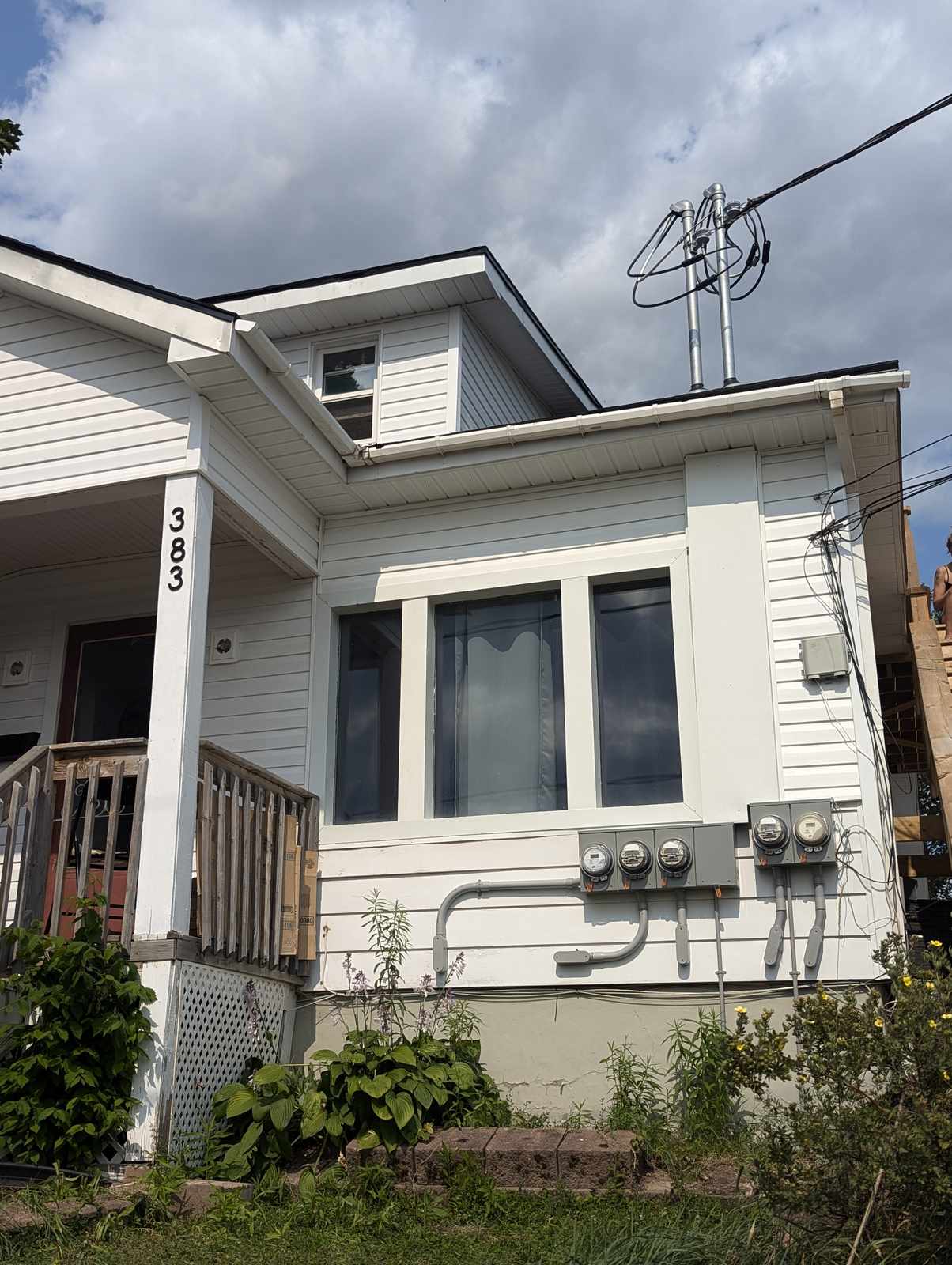 Finished white vinyl siding renovation on Grand Prix Street, Dieppe, NB by Valhalla Construction