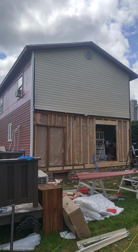 Rebuilt wall framing exposed with insulation during a structural repair