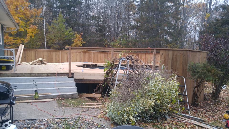 Pool deck decking and steps under construction with privacy surround, Moncton NB