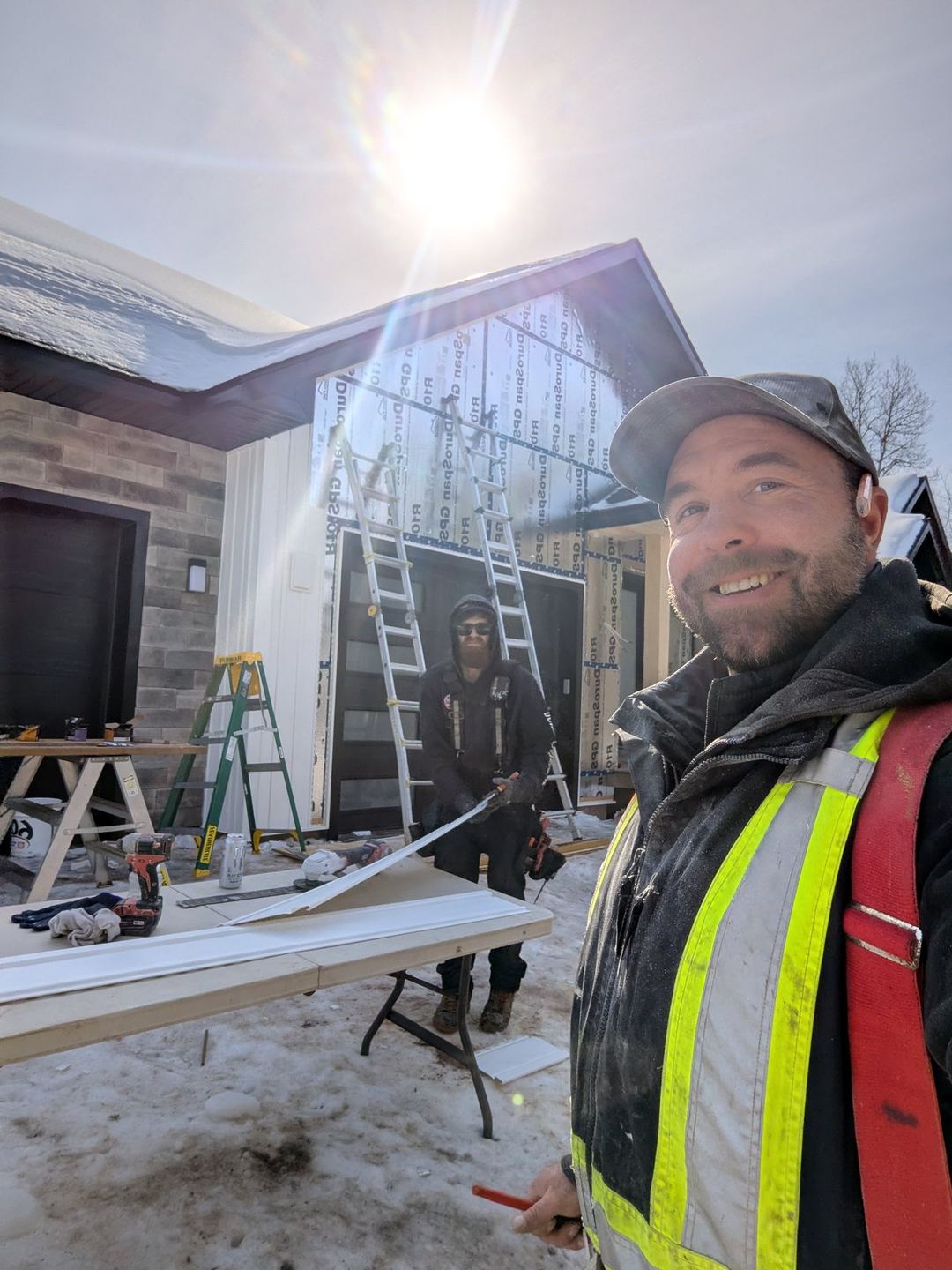 Valhalla Construction crew installing siding, Moncton NB